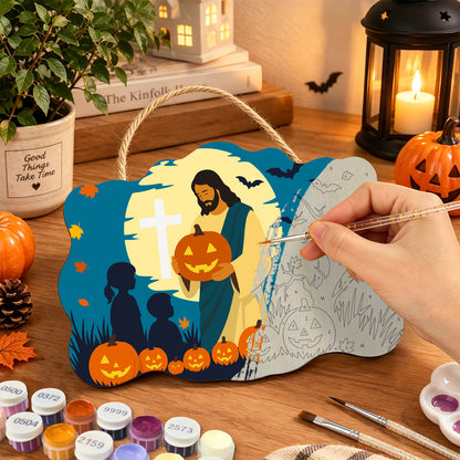 Pancarte Partage sous la Croix en cours de peinture, pinceau à la main — Maison Artsen